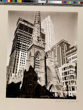 Low angle view of Trinity Church, with RCA Building in background. New York, USA