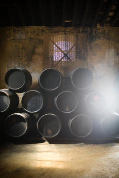 Barrels Of Wine And Brandy In A Cellar.