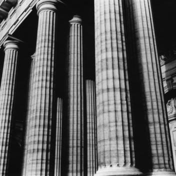 Exterior columns, black and white, low angle view