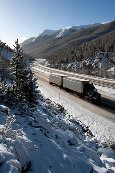 Truck Driving Along Highway I-70 In Winter In Colorado