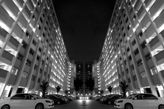 Buildings And Parking Lot At Night