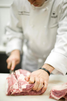 Chef Cutting Slap Of Meat