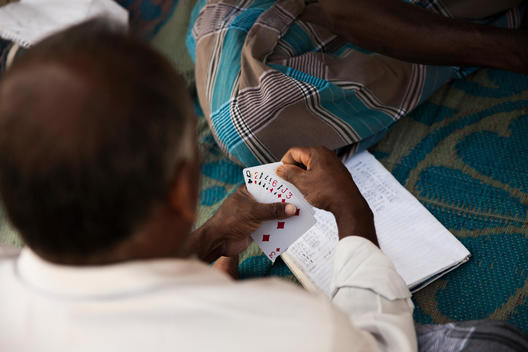 Man holding cards during card game