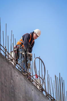 Caucasian worker on top of building