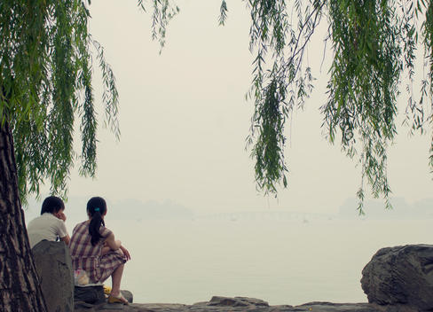 couple looks out over misty water