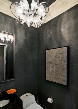 Water Closet With Textured Wall Covering, Art And Contemporary Light Fixture