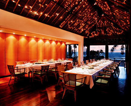Elaborate And Decorative Dining Hall With Long Tables Set For Dinner, Glimmering Lights On Ceiling, View Of Ocean From Room - La Lucciola