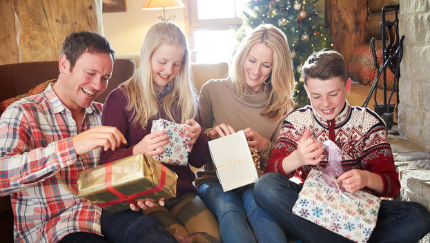 Family opening gifts on Christmas