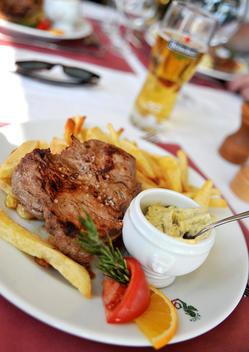 Steak Frites (Steak And Chips)With A Hollandaise Sauce And A Glass Of Heineken Lager