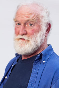 Caucasian Senior Man 60-70 Years Old With White Hair And Beard In Blue Workshirt And T-Shirt, Studio Portrait On White Background