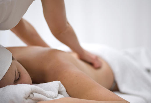 Woman receiving a back and shoulder massage
