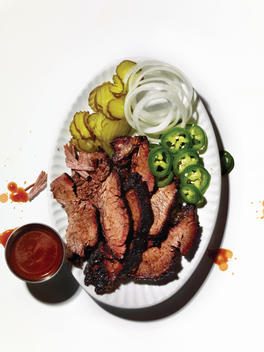 Plate of barbecue meat with barbecue sides.