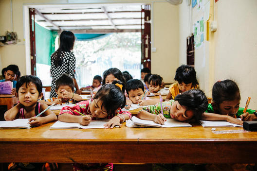 Children do schoolwork at Empowering Youth in Cambodia\'s Impact School in Phnom Penh, Cambodia.