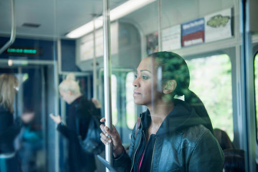 African American woman riding train