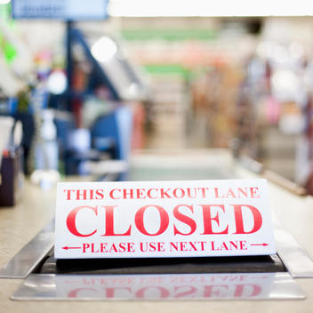 Grocery store check out lane closed sign