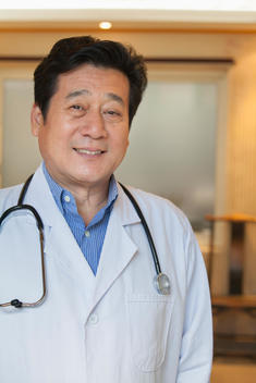 Chinese doctor smiling in office