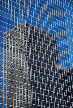 Reflection of buildings on the glass of building, Houston business district, Texas, USA.