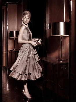 Mad Men style of a blond model in a 1950\'s hotel lobby.