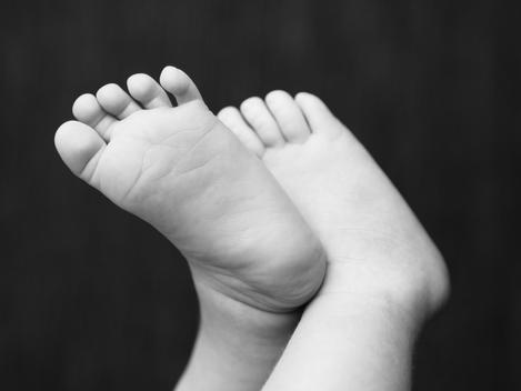 Detail of new born baby\'s feet.