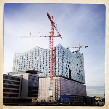 Elbe Philharmonic Hall with construction cranes. Hamburg, Germany