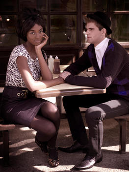 Fashionable Interracial Couple At Café
