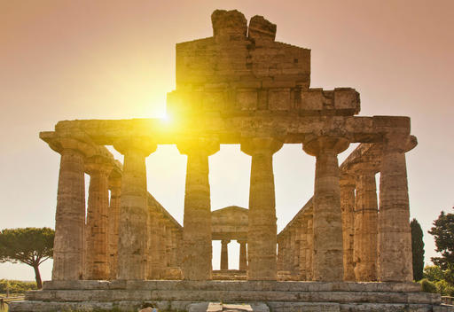 Sun rising over ancient ruins, Paestum, Campania, Italy