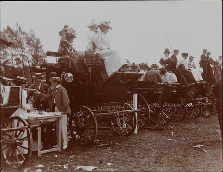 Row Of Carriages With Women And Men Positioned To Watch The Race