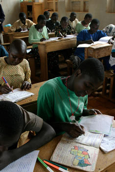 Young students study in a geography lesson at the Nyarutovo Catchup Centre school in Ruhenguri, Rwanda, East Africa.