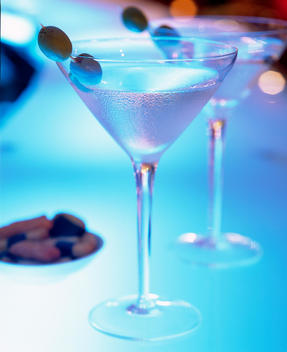 Beautiful Martini Cocktail On Blue Colored Bar Top