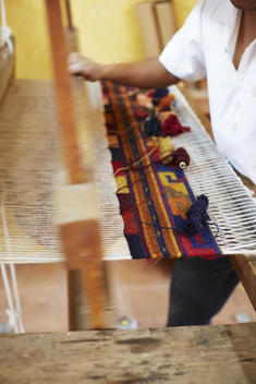 Weaving rugs on a loom