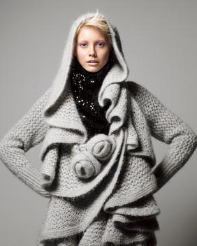 A Girl In Studio With A Knitted Cardigan