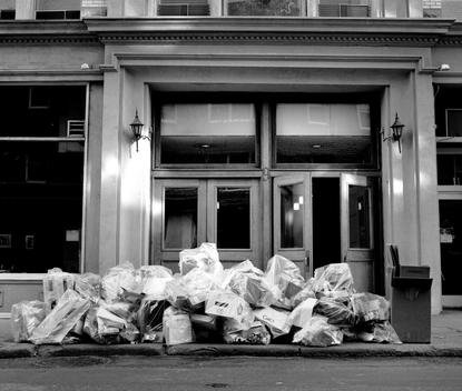 Piles Of Boxes Wrapped In Plastic Bags Wait Their Pickup From Nyc Sanitation