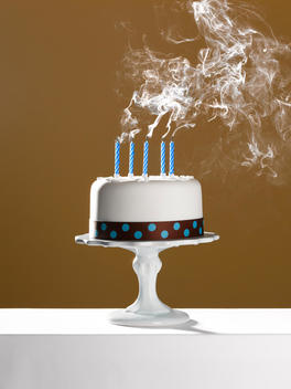 Extinguished birthday candles on birthday cake