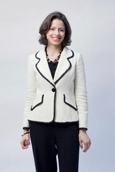 Portrait of 40-45 year old, caucasian, professional woman in business attire, in studio
