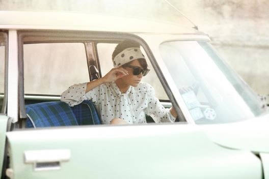girl in vintage car