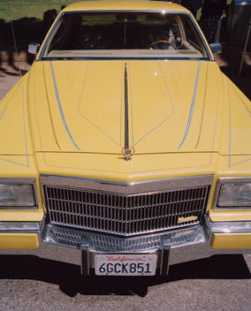 Old yellow Cadillac at low-rider car show