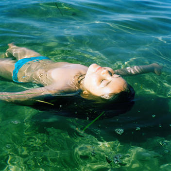 Girl Floating In Water