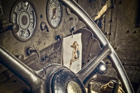 World War II truck interior shows a GI\'s pin up girl calendar.