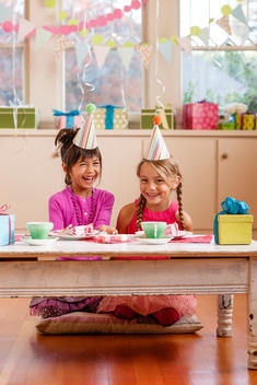 young girls laughing at indoors birthday party