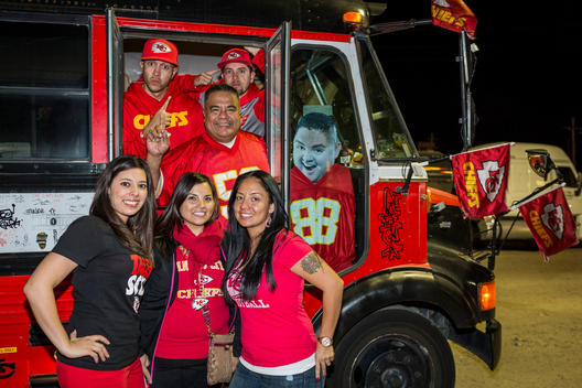 Kansas City Chiefs fans pose with their party bus during the 600-mile road trip to an away game against the Denver Broncos.