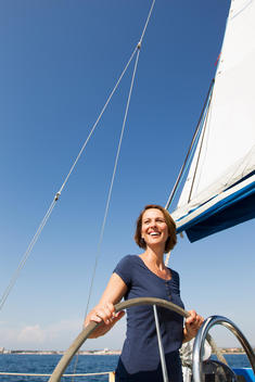 Smiling woman driving boat