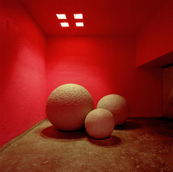 Decorative Stone Spheres Near Orange Walls