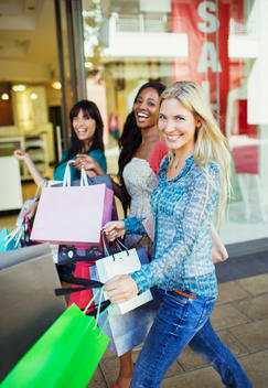 Women carrying shopping bags in shopping mall