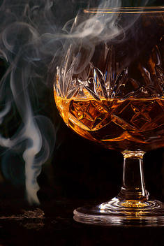 Brandy Glass And Cigar Smoke