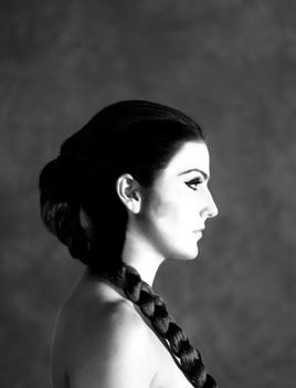 Profile Portrait Of A Pretty Woman With Braided Hair