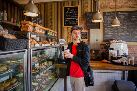 Young, urban man in coffee shop in Brooklyn.