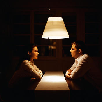 Man and woman face to face at table