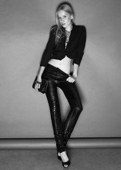 Seductive Woman Wearing A Cropped Jacket And Tight Pants