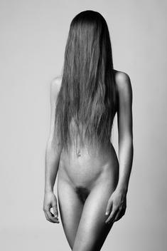Female nude with hair covering face