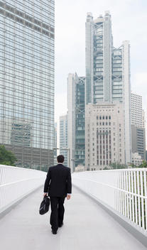 Businessman On Way To Work In City